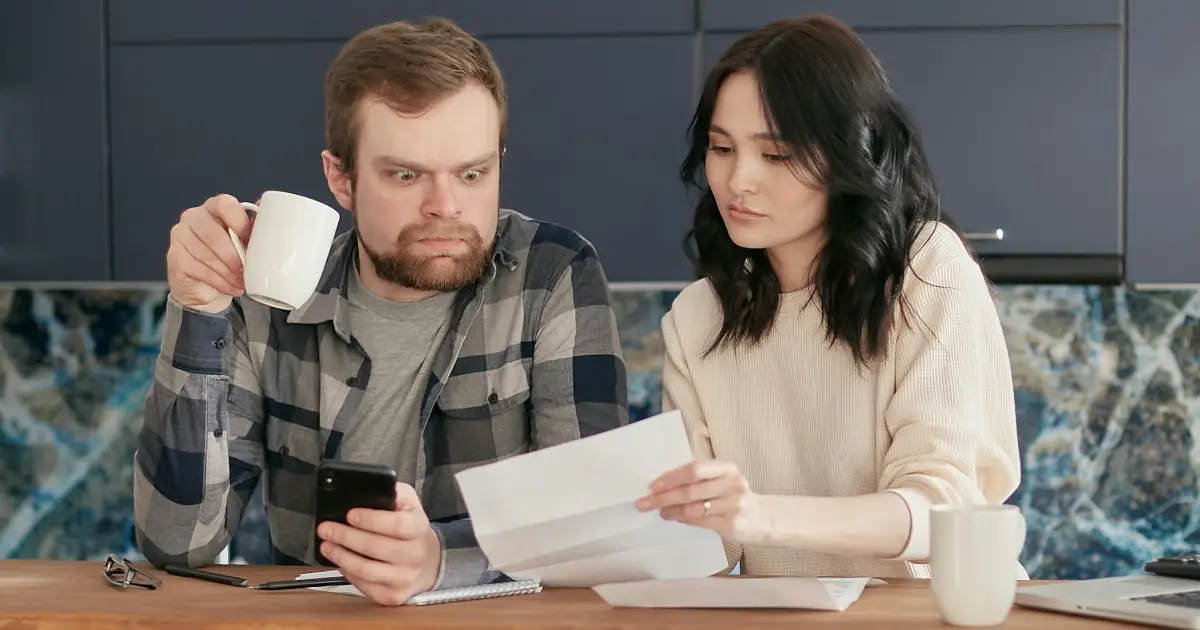 couple comparing moving costs denver