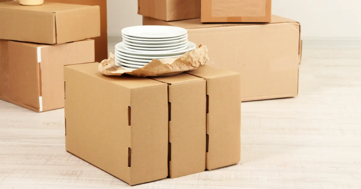 dishes being securely packed into boxes